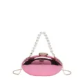 Borsa pochette ovale in acrilico rosa con elegante manico di perle e tracolla in metallo. - Rosa (Con Manico)