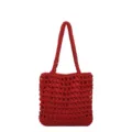 Detailed view of the red crochet hollow-out knit texture and sturdy shoulder strap design. - Red