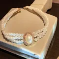 French vintage multi-layer faux pearl choker necklace with rhinestone oval pendant. - Gold Rhinestone Studded Pearl Necklaces