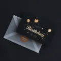 Schwarze Geburtstagskarte mit Heißfolienprägung und transparentem Umschlag sowie Aufkleber. - Alles Gute zum Geburtstag Ballon / 50 Blatt