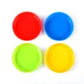 Close up details of four vibrant colored plastic paint mixing trays for art crafts. - 13.2x3cm / Four Colors
