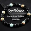 Close-up detail of multi-stone beaded stretch bracelet with natural lava and hematite beads. - Shoushan Stone