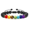 Detailed close-up showing the texture of chakra stone and tiger eye bead bracelet. - Braided Rainbow