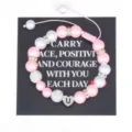 Handmade pink pearl bracelet featuring sparkling rhinestone beads and stainless steel heart charm. - Letter U