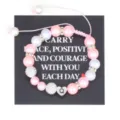 Handmade pink pearl bracelet detail view with stainless steel letter charm and rhinestones. - Letter Q