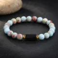 Natural stone beaded bracelet detail shot, elegant gemstone beads with central black pillar. - 6mm Beads / Shoushan Stone & Black Tourmaline