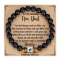 Matte black and tiger eye bead bracelet with footprint charm for new dad gift presentation. - Dad with Paw Print Square Bead and Card / Black