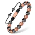 Vue détaillée du bracelet réglable en perles avec des sphères noires et or rose. - Hématite cuivre or rose 8 mm 01
