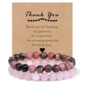 Close-up detail of double-layer beaded bracelet set with pink natural stone and thank you card. - Black Cord Rhodochrosite & Rose Quartz