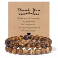 Detailed close-up view of double-layer gemstone bead bracelets displayed on a brown kraft card. - Tiger's Eye & Picture Jasper