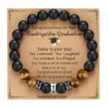 Graduation beaded bracelet featuring matte black obsidian, tiger's eye, and cross charms. - With Card / Style 6