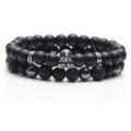 Matte black volcanic stone and obsidian double-layer beaded bracelet with metal charm. - 32