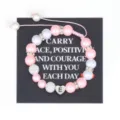 Handmade pink pearl beaded bracelet with stainless steel initial heart charm for women daily wear. - Letter E