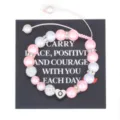Handcrafted pink pearl bracelet with initial heart charm and black display card - Letter O
