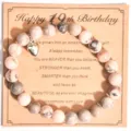 Detalle de pulsera de cuentas de jaspe rosa con bonito colgante de corazón plateado. - Estilo 19 Cumpleaños