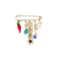 Detail shot of vintage gold safety pin brooch with colorful rhinestone charms and animal pendants. - Vintage Gold Multi-Color