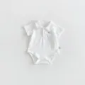 Detailed view of white baby short sleeve polo bodysuit featuring cute dog embroidery, soft cotton. - 66cm / White