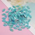 Close-up details of sparkling blue resin marquise rhinestones designed for DIY craft accessories. - Marquise Pineapple Cut Resin Plated Back / 100 Pieces (7x15mm) / Aqua Blue AB
