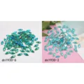 Close-up of AB resin rhinestone flatbacks, horse eye shape for DIY clothing crafts. - 100 Pieces/Pack / Turquoise