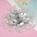 Detail view of 7x15mm horse eye resin rhinestones, sparkling flatback DIY craft charms. - AB White