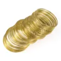 Close-up detail of golden memory wire loops bundle for DIY jewelry craft making accessories. - Gold Tone