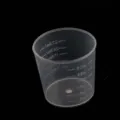 Disposable plastic measuring cup with clear graduation marks, ideal for DIY epoxy resin crafts. - 30ml Measuring Cup / 20 Pieces Set