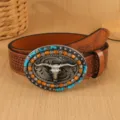 Close-up detail of western retro belt featuring bull skull buckle and embossed PU leather strap. - 100cm / Amber
