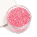 Colorful resin flatback rhinestones in a clear box, perfect for nail art and DIY jewelry crafting. - Pink AB