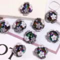 Colorful electroplated acrylic beads with floral rhinestones, ideal for DIY crafts and phone chains. - 17x20mm / Black