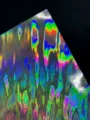 Detailed view of 128g holographic laser cardstock, vibrant double-flash specialty paper. - Flame