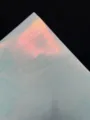 Special paper detail showing iridescent silk texture for badge packaging, glossy finish craft paper. - Iridescent Blue Base Silk Style