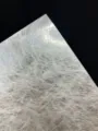 Detailed shot of glossy silk specialty paper backing, ideal for craft packaging. - Silver Silk Style