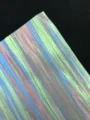 Detailed close-up view of colorful silk series shiny special paper for badge backing. - Tassel Three Colors Style