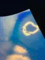 Close-up detail of holographic glitter specialty paper with reflective golden heart pattern. - Dreamy Gold