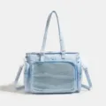 Bolso bandolera ita azul claro con estampado de estrellas y bolsillo transparente con malla. - Azul