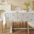 White cotton tablecloth with floral embroidery and elegant tassel edge for dining room decor. - 90x90cm / Embroidered 9-Color Flowers with White Tassels (Waterproof)