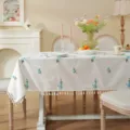 White cotton tablecloth with blue floral embroidery and tassel fringe for dining table decor. - 90x90cm / Embroidered Blue Peach Blossom with Tassels (Waterproof)