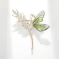 Elegant dragonfly wheat ear brooch featuring sparkling white cubic zirconia and green translucent wings. - Green Wheat Dragonfly Brooch (C2152)