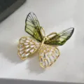 Exquisite butterfly brooch with green translucent wings and sparkling clear cubic zirconia stones. - Green Long Butterfly Brooch (C2152)