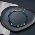 Bracelet double couche croix avec cristaux bleu océan et perles noires en acier inoxydable. - Bracelet Double Couche Cristal Bleu Croix (S0046-A)