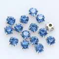 Runde blaue Glas-Strasssteine mit silbernen Krallenfassungen für Bekleidung und Zubehör. - 6mm (36 Stück/Packung) / Hellblau