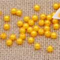 Wholesale 4-8mm double hole yellow ABS imitation pearl loose beads for DIY crafts and garment sewing accessories. - Golden Yellow