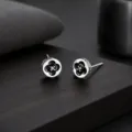 Élégantes boucles d'oreilles trèfle à quatre feuilles avec émail noir et brillant. - Noir