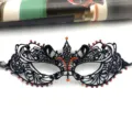 Black lace masquerade eye mask with orange rhinestones for Halloween party detail view. - One Size / Black Red Rhinestone