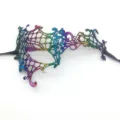 Colorful lace masquerade mask with gradient embroidery and black ribbon ties. Detail view. - One Eye Monster