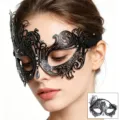 Close-up of black metal masquerade mask with rhinestones and drop pendant, exquisite filigree details. - Black Phoenix