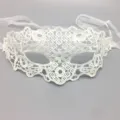 Detailed view of the elegant white lace mask with delicate hollow embroidery and soft ribbon ties. - One Size / Zorro / White