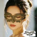 Detailed shot of gold lace masquerade mask worn by model, perfect for Halloween party. - Gold