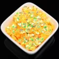 6mm golden plum blossom sequins in white bowl, ideal for hand sewing, DIY crafts, and garments. - 20g/Pack (Approx. 1200 Pieces) / Yellow