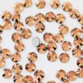 Close-up detail of copper color flatback glass rhinestones for DIY nail art and phone decor. - SS3 (Approx 1.3MM) Approx 1440 Pcs / Light Rose Gold